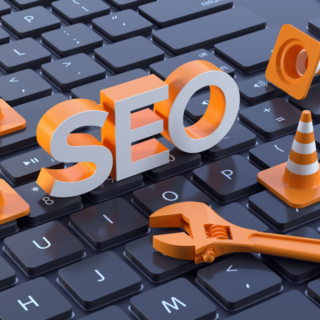 The word 'SEO' is constructed with 3D letters and tools like a wrench and traffic cones on a keyboard, highlighting SEO-optimized product description writing services.