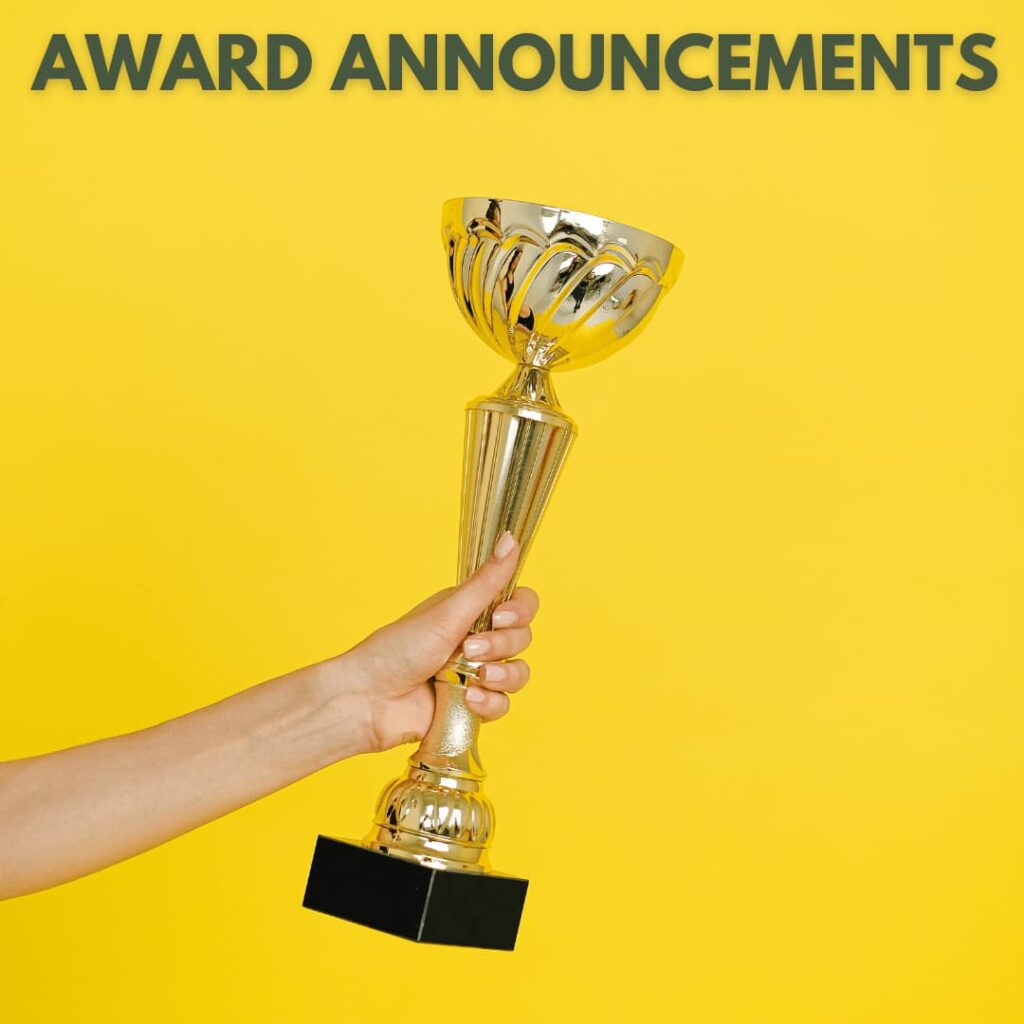 A hand holding a shiny trophy against a vibrant yellow background, symbolizing award announcements and recognition, emphasizing the press release writing services for award announcements and recognition.