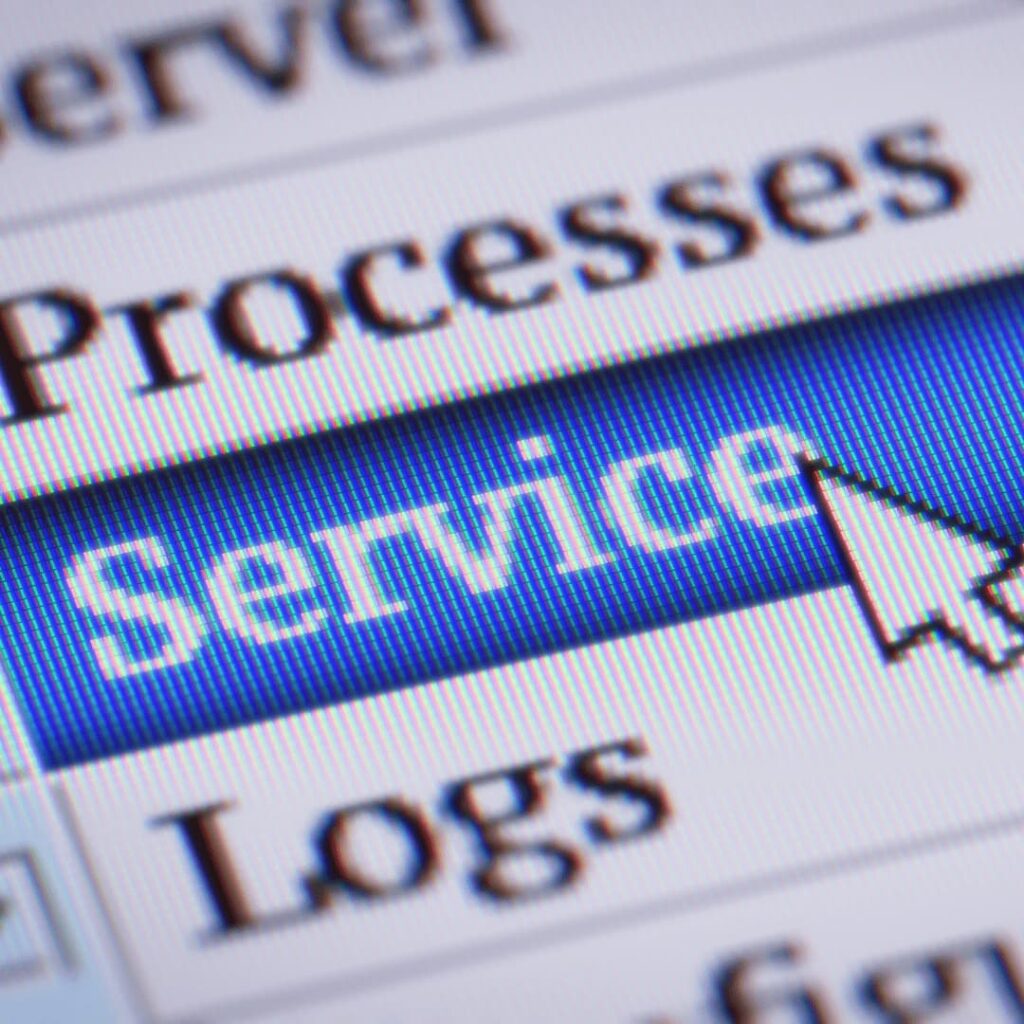 A close-up of a computer screen with the cursor pointing at the word "Service" in a menu, indicating beyond the listed services, representing any type of custom content development services